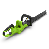 A Greenworks cordless hedge trimmer with a bright lime green body and black blade, handle, and guard, shown on a clean white background.